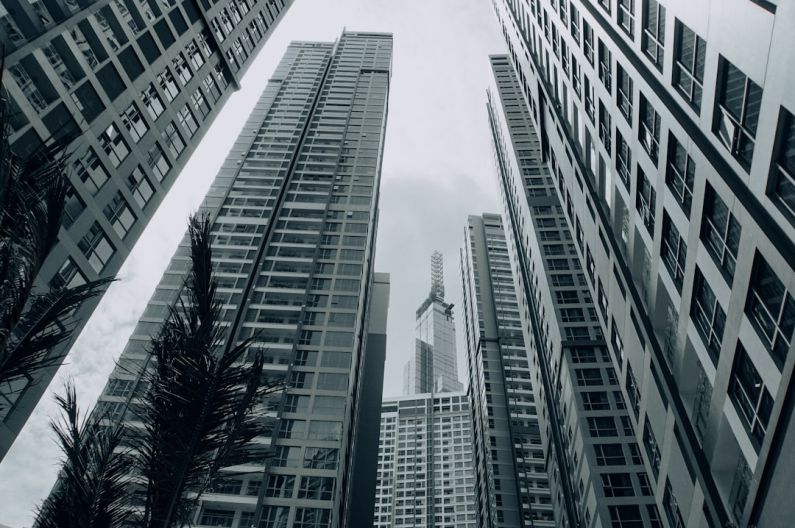 Commercial Property - grayscale photo of high rise buildings