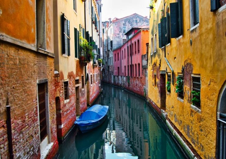 Foreclosed Homes - blue boat on Venice Canal at daytime